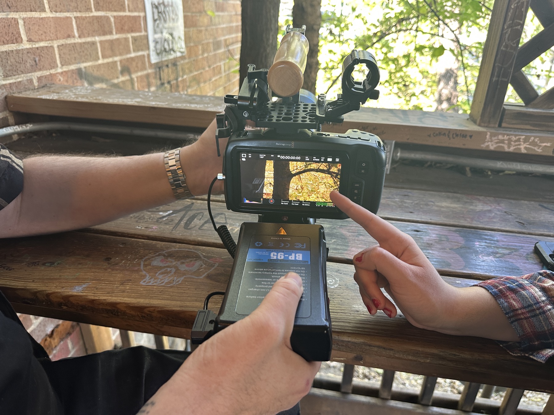 Two crew members reviewing a shot on the camera monitor